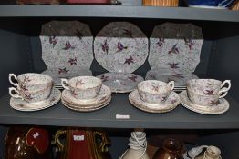 An early art deco part tea service hand decorated bone China with gilt and colour full geometric