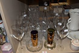 A mixed lot of glass including wine glasses, cut glass ash tray, vases and decanter.