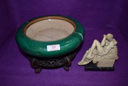 A very heavy set Chinese hard paste bowl having Guan type glaze over Jade green ground having been