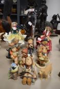 A collection of Goebel figurines, two Royal Doulton figurines and more.