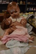 A mid century Pedigree doll having poseable limbs and sleep eyes, she even comes with a change of