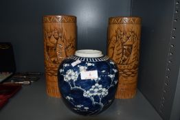 A blue and white Chinese ginger jar and pair of mirrored bamboo brush pots
