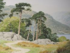 A watercolour, Geoffrey H Pooley, Pines by Ullswater, signed and dated 2002, and attributed verso,