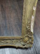 A gilt plaster picture frame