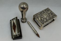 An Edwardian over sized match box cover having bird and scroll decoration, Birmingham 1901, Henry