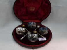 A cased set of four Victorian silver salts of bowl form having gadrooned decoration, London 1896/