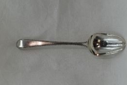 A Georgian silver table spoon in the Old English bead pattern, London 1780, George Smith