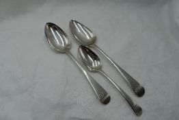 Two Georgian table spoons of Old English form bearing monogram to terminals, London 1803/17,