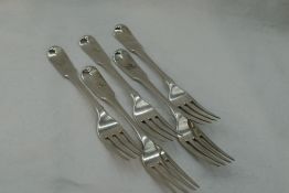 Five Georgian silver table forks of fiddle back form bearing unicorn crest to terminals, London