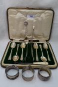 A small selection of HM silver including six teaspoons, sugar nips, napkin rings, souvenir spoon and