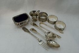 A selection of HM silver including napkin rings, miniature tankard, salt with blue glass liner, a