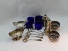 A selection of HM silver salts and pepperettes of assorted designs, five HM silver salt spoons and