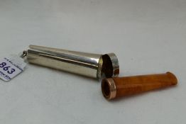 An Edwardian silver cigar holder case of plain form containing an amber cigar holder with 9ct rose