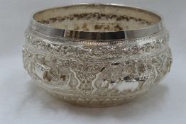 A Burmese silver bowl having elephant and oxen scenic repousse decoration and presentation
