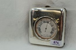 A London made base metal desk barometer in the form of an over sized pocket watch in an Edwardian