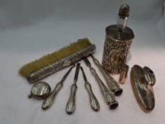 A Victorian glass bottle having silver embossed cover and stopper, Birmingham 1898, Arthur Wilmore