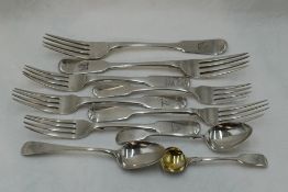 Seven Georgian and Victorian silver table and dessert forks all of fiddle back form, all Exeter