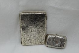 A Victorian silver aide memoire purse having engraved scroll decoration and monogrammed cartouche
