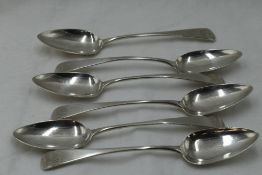 Six Georgian silver dessert spoons of Old English form bearing monogram to terminals, London 1803,