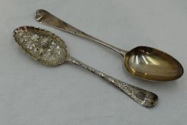 A Georgian silver berry spoon having frilled rim to bowl and later chased stem, London 1749,