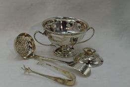 A small selection of HM silver including a sugar bowl having facetted decoration, loop handles amd