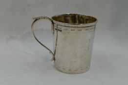 A silver christening mug having bright cut decoration and inscribed Bernard 1922, Sheffield 1919,