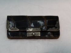 A small Edwardian brown leather coin purse having silver fitments, London 1902 & Birmingham 1902