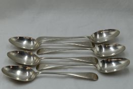 Six Edwardian silver dessert spoons of plain form bearing monogram G to terminals, Chester 1906,