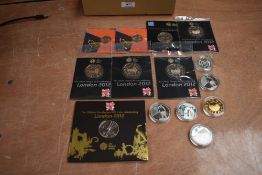A collection of UK London Olympic Games Coins including six 5 Pound Silver Proof Coins, six Cupro-