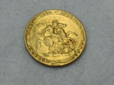 A Gold George III 1820 Laurel Head Sovereign with George and Dragon on reverse, in plastic case