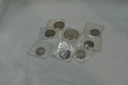 Eight English Coins, a 1711 Queen Anne Shilling, a 1758 George II Shilling, a 1817 George III
