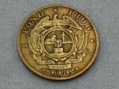 A Gold South Africa 1898 One Pond (gold 0.9160) weight approx just below 8 grams, in plastic case