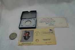 A 1982 Silver 250th Anniversary of Washington Half Dollar, a Morgan 1880 Silver Dollar and a