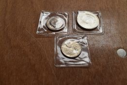 Three Coins, a USA 1921 Silver Dollar, a 1923 Monroe Doctrine Centennial Half Dollar and a 1920