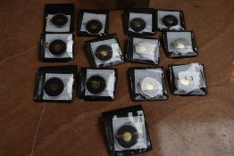 A collection of 13 Tristan Da Cunha 1 Gram Proof 9 Carat Gold Coins in plastic cases