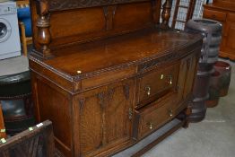 An early 20th Century oak sideboard having ledge back, approx. width 136cm