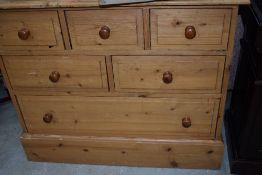 A vintage pine shallow chest of 'Ted Rogers' drawers, dimensions approx. W88 D29 H83cm (including