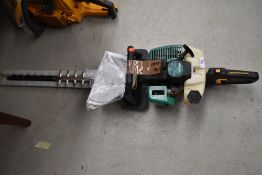 A Gardenline petrol hedge trimmer