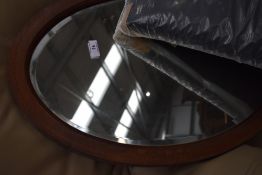 A bevel edged mahogany framed mirror with band detailing