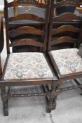 A set of four traditional ladderback dining chairs
