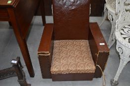 A 1930s childs armchair of Art Deco design, studded leather decoration, width approx. 51cm