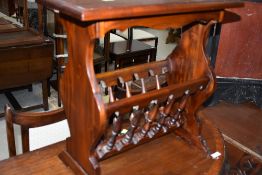 A modern hardwood side table/magazine rack