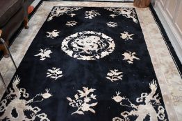 Two modern chinese rugs, in black and cream, approx. 300 x 196cm and 196 x 90cm