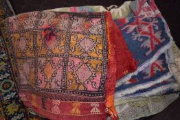 A traditional tribal style saddlebag and similar throws