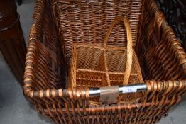 A selection of moden baskets, comprising log or similar, hamper and bottle carrier
