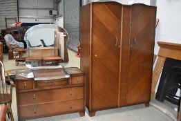 A mid 20th Century oak and ply wardrobe and dressing table