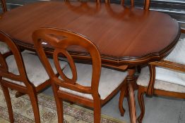 A modern extending dining table, good quality (Rossmore or similar) possibly Cherry and six (four