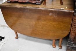 An early to mid 20th Century oak gate leg table, on Queen Anne style legs, width approx. 107cm