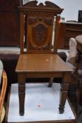 A traditional oak hall chair