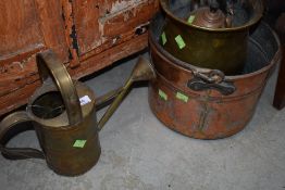 A selection of copper and brassware including kettle and watering can